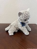 Full left side view of ceramic spaghetti cat figurine