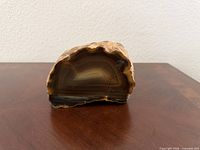 Front view polished face displaying banding