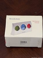 Front of unopened Brookstone Rainbow Clock box
