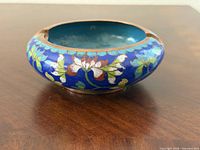 Oblique view showing exterior blue enamel and floral cloisonné