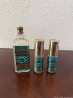 Front view of Eau de Cologne bottle and two natural spray minis