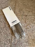 Closed Hiware box with bubble-wrapped stainless picks protruding