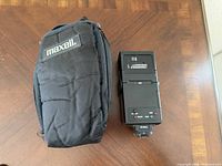 Maxell case next to Achiever flash showing overall lot