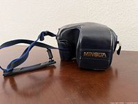 Minolta fitted camera case with attached shoulder strap