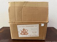 Closed shipping carton with Old Dutch International label