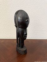 Front three-quarter view of carved bust