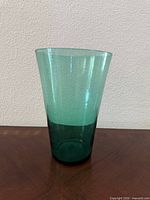 Front view of sea-green glass vase