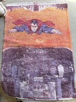 Full view of rug showing Superman and city scene