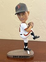 Front left view of Dave Dravecky bobblehead showing face, uniform, base label
