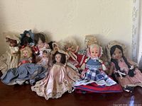 Group view of all dolls lined on shelf