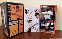 Three bobblehead boxes: Brian Wilson 2009, Mike Krukow #20, Hunter Pence