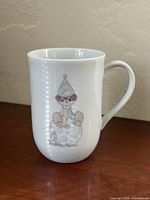 Front of mug showing clown and dog graphic