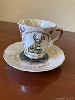 Teacup on saucer, front deer crest visible