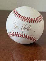 Side view of baseball showing Bill Mueller autograph