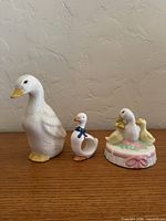 Front view of all three ceramic duck items