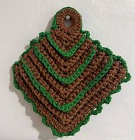 Front view of crocheted potholder showing layered design and colors