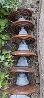 String of six brown porcelain disc insulators
