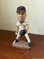 Front view of Jason Schmidt bobblehead showing uniform, glove, ball, base text