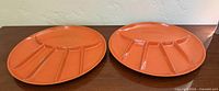 Both orange divided plates top view