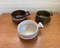 Top view of three handled stoneware pots