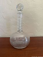 Front view showing etched body, facet-cut neck and stopper