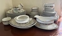 Full set showing stacks of plates, bowls, cups, serving pieces