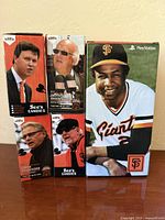 Group shot of five boxed Giants bobbleheads showing front graphics and branding