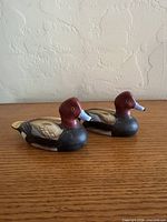 Front view of both ceramic duck decoys