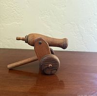 right side view showing barrel, wheels and support