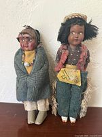 Front view of both dolls standing upright