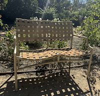 Full front view of Brown Jordan strap bench
