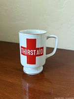 Front view showing THIRSTAID graphic
