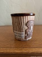 Front view showing Harvey’s Lake Tahoe inscription and woodgrain finish