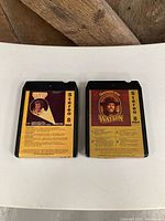 Front view of both 8-track tapes showing titles and labels