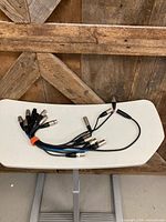 Group of nine short XLR cables on table