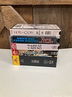 Front view of all five VHS tapes stacked showing spine titles