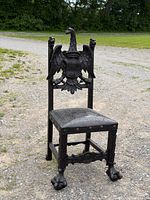 Full view of carved chair angled left