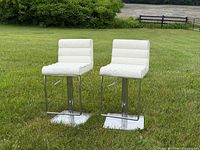 Front view of both bar stools on lawn