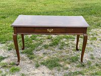 front view showing full table, drawer, legs and top