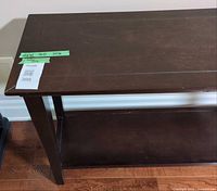 Top view of console table showing finish and measurement tape