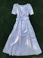 front view of blush pink satin dress with sash