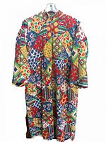 Front view of full-length multicolor patchwork quilt coat hanging