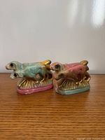 Front view of both chalkware dog figurines showing colors and detailing