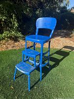 Front view of blue Cosco metal chair with both steps extended
