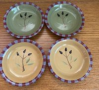Top view showing all four dishes, two color variations and leaf motif