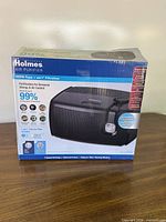 Front view of boxed Holmes HAP9241B Aer1 air purifier