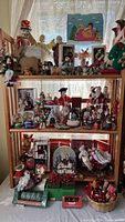 Full view of three-tier shelf filled with Christmas decorations