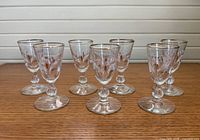 Front view of all seven stemmed cordial glasses