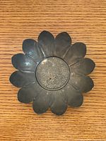 Top view of brass lotus flower bowl showing petal design and engraved center