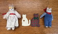 Group view of four cat ornaments